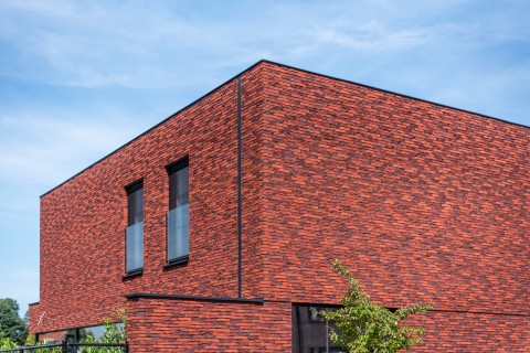 Gevel met ingewerkte regenpijp